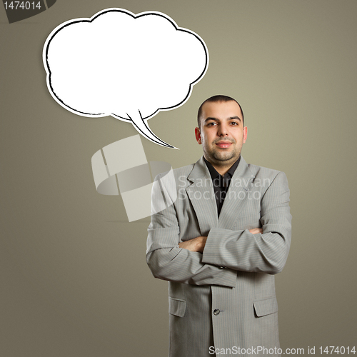 Image of male in suit with crossed hands and speech bubble
