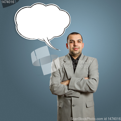 Image of male in suit with crossed hands and speech bubble