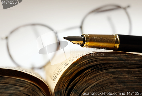 Image of Old book and pen