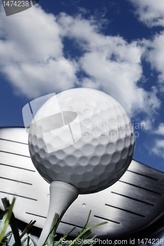 Image of Golf club and ball in grass