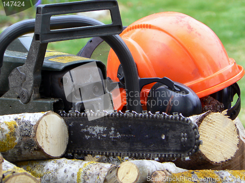 Image of Chainsaw and helmet