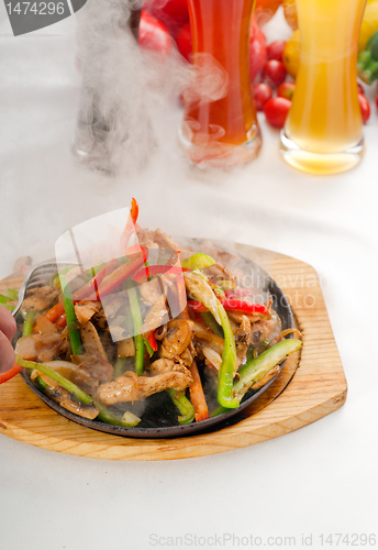 Image of original fajita sizzling hot  on iron plate