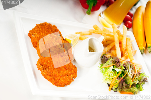 Image of classic Milanese veal cutlets and vegetables