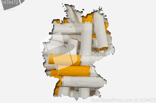 Image of Outline map of Germany with cigarettes in background