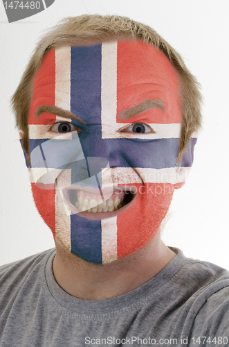 Image of Face of crazy angry man painted in colors of norway flag