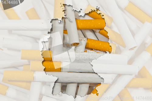 Image of Outline map of Germany with transparent cigarettes in background