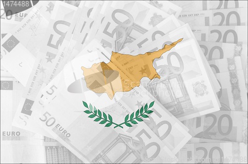 Image of flag of Cyprus with transparent euro banknotes in background 