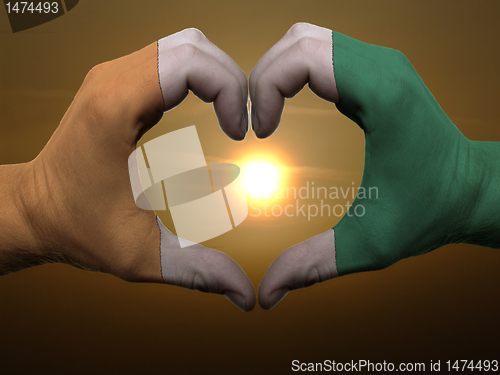 Image of Heart and love gesture by hands colored in cote'd ivore flag dur