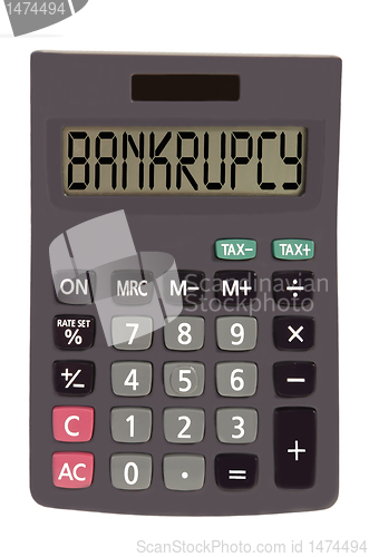 Image of Old calculator on white background showing text "bankrupcy"