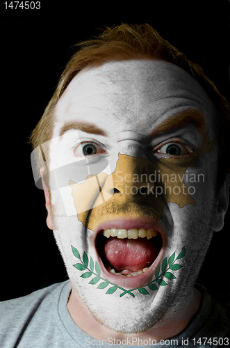 Image of Face of crazy angry man painted in colors of Cyprus flag