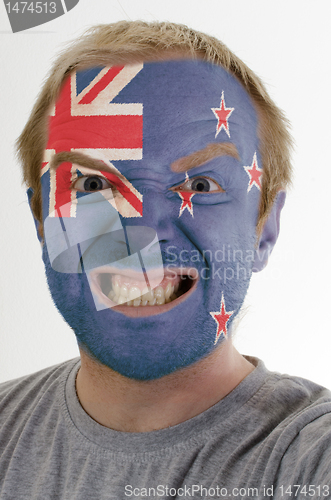 Image of Face of crazy angry man painted in colors of new zealand flag