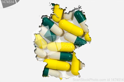 Image of Outline map of Germany with pills in background