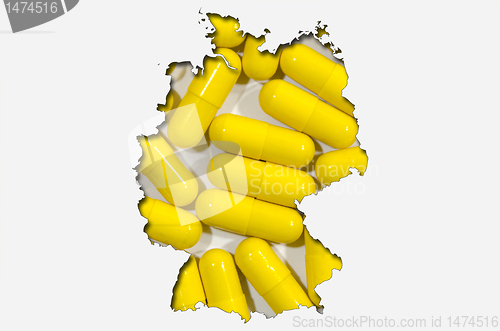 Image of Outline map of Germany with pills in background