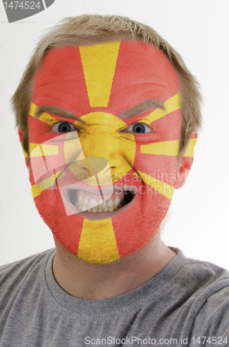 Image of Face of crazy angry man painted in colors of macedonia flag