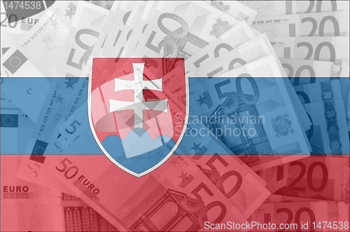 Image of flag of Slovakia with transparent euro banknotes in background 