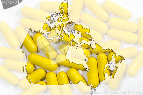 Image of Map of Canada with capsules in background