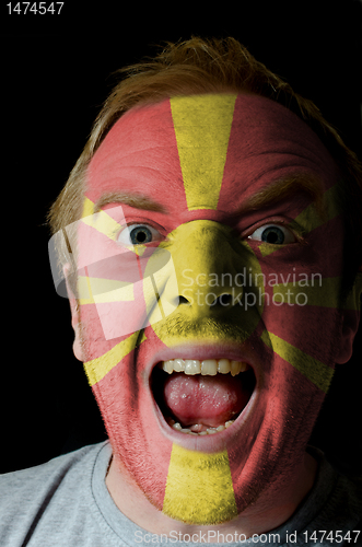 Image of Face of crazy angry man painted in colors of macedonia flag