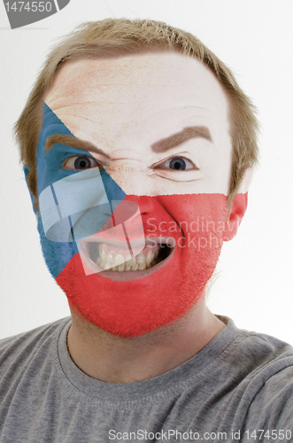 Image of Face of crazy angry man painted in colors of czech flag