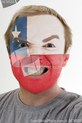 Image of Face of crazy angry man painted in colors of chile flag