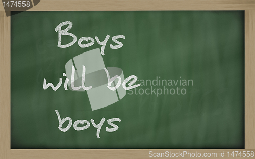 Image of " Boys will be boys " written on a blackboard