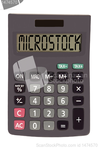 Image of Old calculator on white background showing text "microstock"