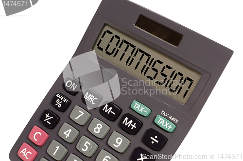 Image of Old calculator on white background showing text "commision" in p