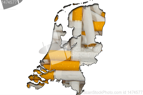 Image of Outline map of Netherlands with cigarettes in background