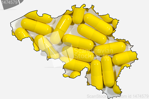 Image of Outline map of Belgium with pills in background