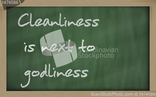 Image of " Cleanliness is next to godliness " written on a blackboard