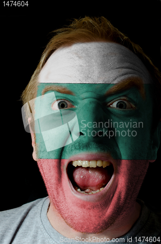 Image of Face of crazy angry man painted in colors of Bulgarial flag