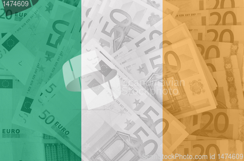 Image of flag of Ireland with transparent euro banknotes in background 