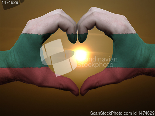 Image of Heart and love gesture by hands colored in bulgaria flag during 