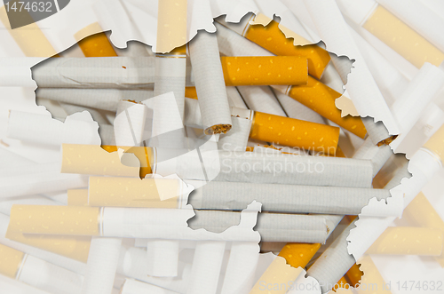 Image of Outline map of Belgium with transparent cigarettes in background