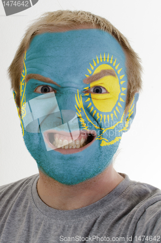 Image of Face of crazy angry man painted in colors of kazakstan flag