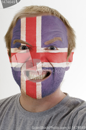 Image of Face of crazy angry man painted in colors of iceland flag