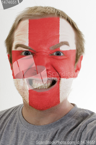 Image of Face of crazy angry man painted in colors of england flag