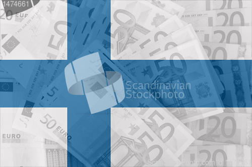 Image of flag of Finland with transparent euro banknotes in background 