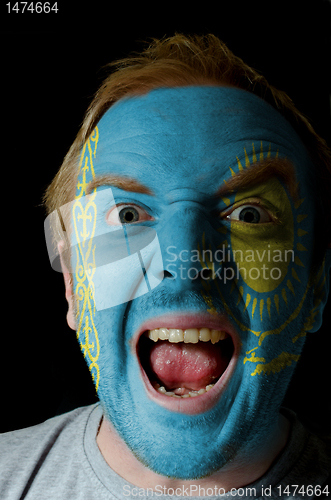 Image of Face of crazy angry man painted in colors of kazakstan flag