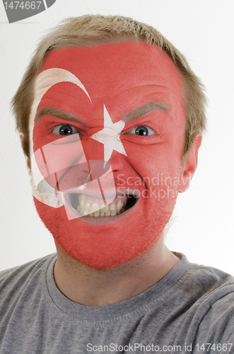 Image of Face of crazy angry man painted in colors of Turkey flag