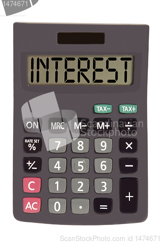 Image of Old calculator on white background showing text "interest"