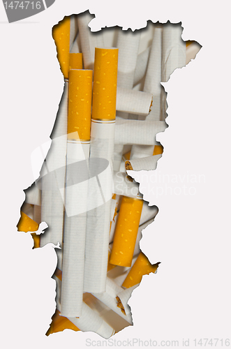 Image of Outline map of Portugal with cigarettes in background