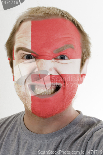 Image of Face of crazy angry man painted in colors of denmark flag