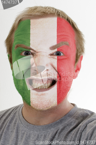 Image of Face of crazy angry man painted in colors of italy flag