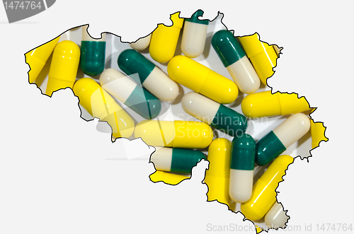 Image of Outline map of Belgium with pills in background