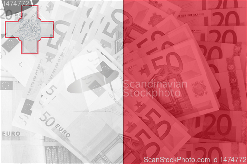 Image of flag of Malta with transparent euro banknotes in background 