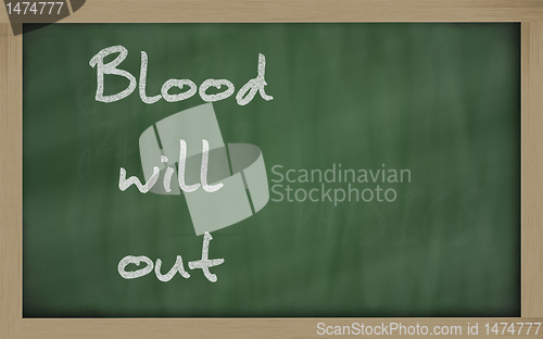 Image of " Blood will out " written on a blackboard