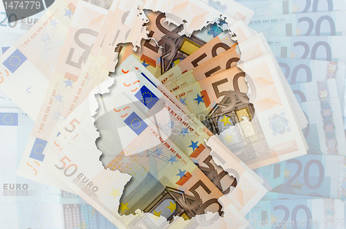 Image of Outline map of Germany with transparent euro banknotes in backgr