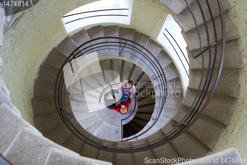 Image of beautiful young girl with mother on staircase