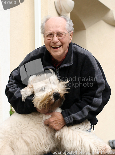 Image of Happy senior man and his dog