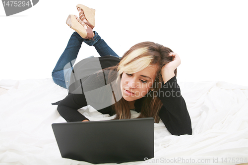 Image of Beautiful isolated teen laptop girl on bed